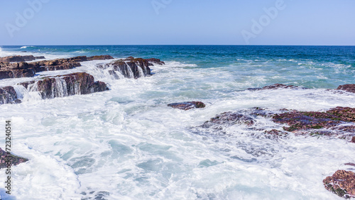 Rocky Beach Ocean Waves Crashing White Water Wash Horizon Landscape.