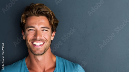 Cheerful middle aged man in studio shot, ideal for advertising with copy space on the left side