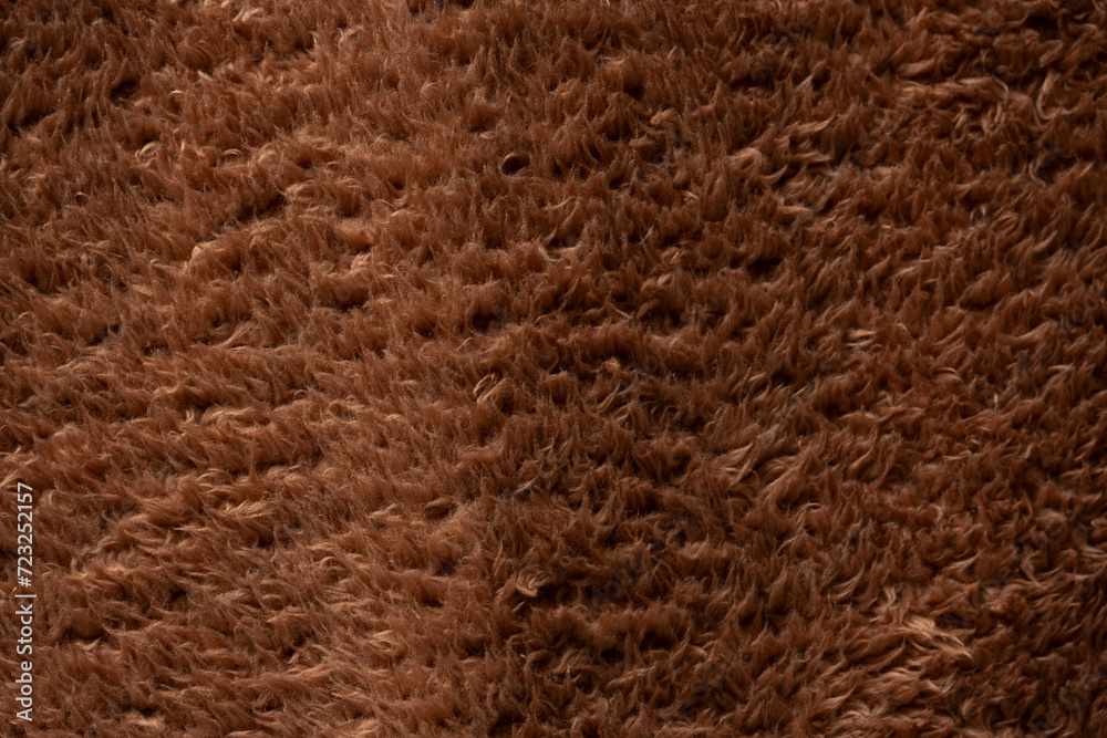 Texture of a brown faux fur as a background. Texture of a brown faux fur as a background.