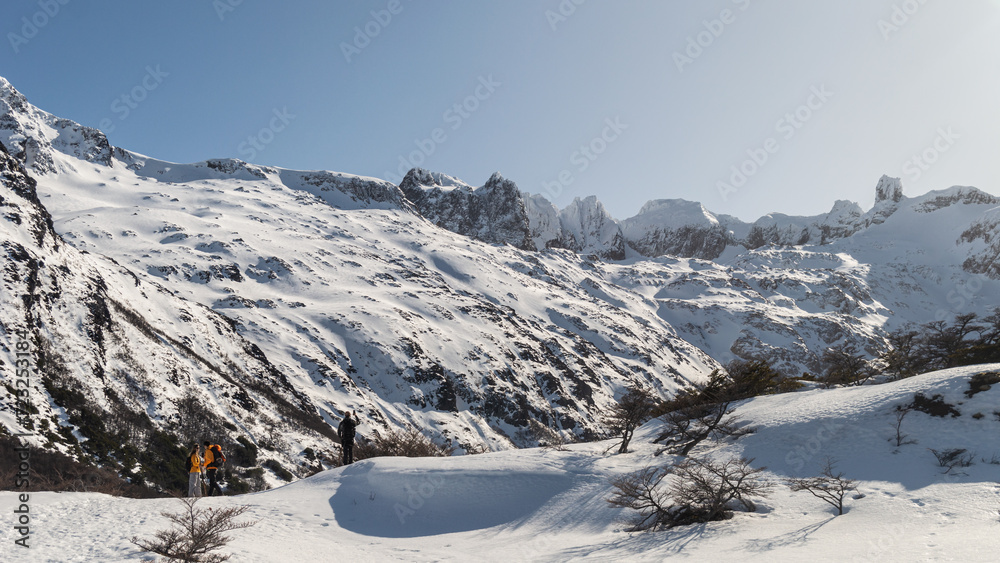People on the heights of snowy mountains.