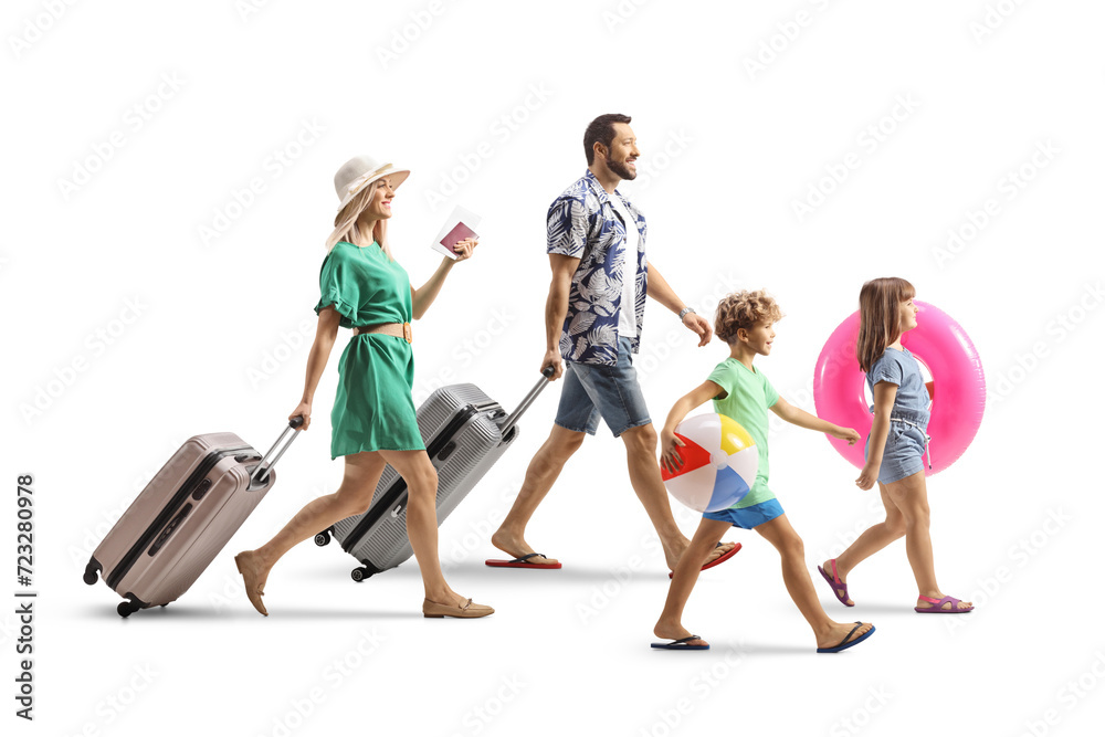 Obraz premium Family going on a summer vacation, packed with suitcases and beach accessories