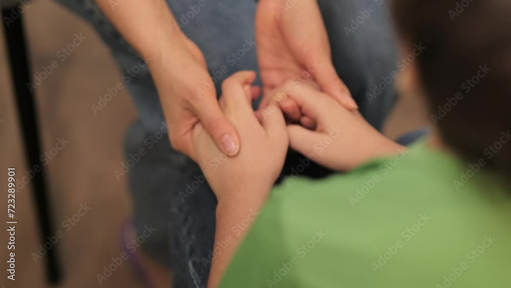 The nurturing touch from a caregiver to a child in need, symbolizing the protective bond and emotional sanctuary provided. The nurturing touch from a caregiver to a child in need, symbolizing the protective bond and emotional sanctuary provided.