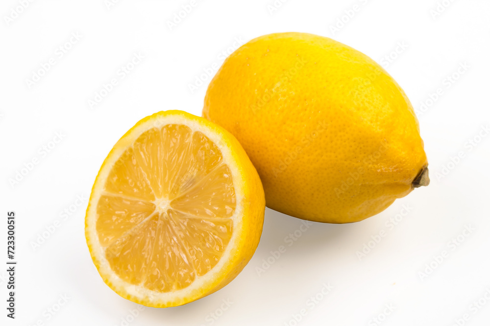 Lemon isolate on white. Lemon fruit whole and a half with leaves. Side view on white. With clipping path. Lemon isolate on white. Lemon fruit whole and a half with leaves. Side view on white. With clipping path.