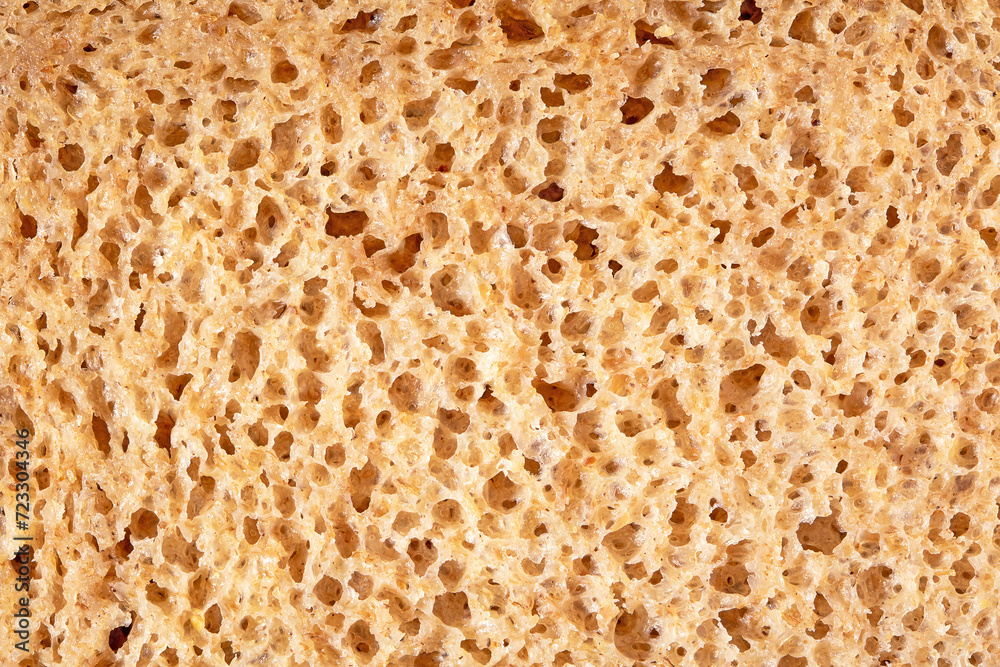 Detailed close-up view of sliced bread texture, freshly baked wheat loaf surface Detailed close-up view of sliced bread texture, freshly baked wheat loaf surface