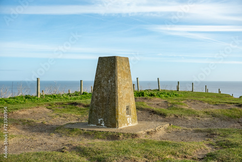 Concrete marker post on the summit of Beeston Hill on the North Norfolk coastal path