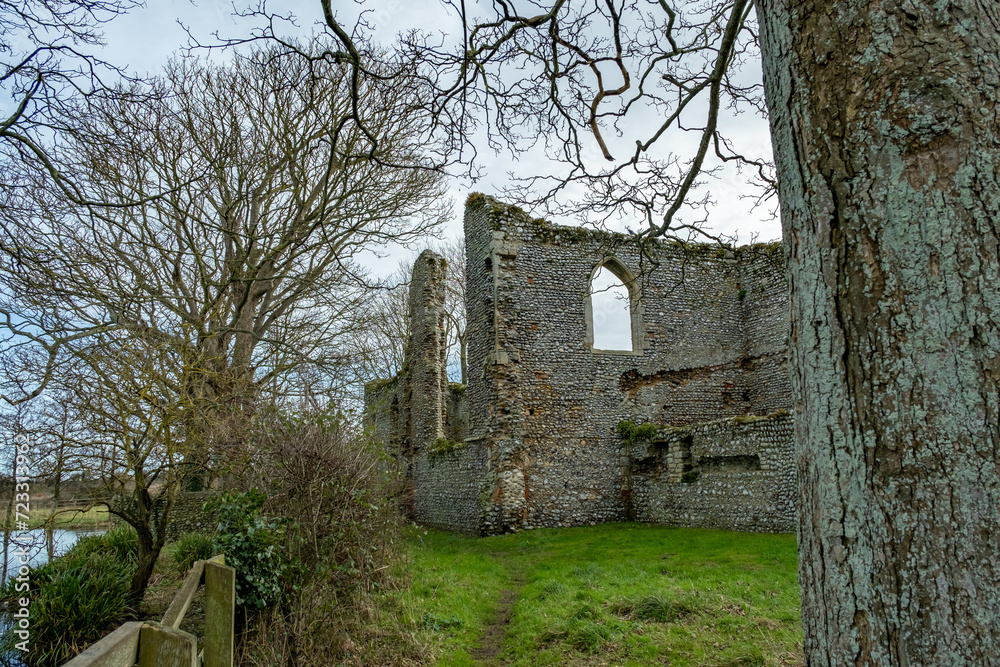 The ancient and abandoned ruins of a priory in the Norfolk countryside