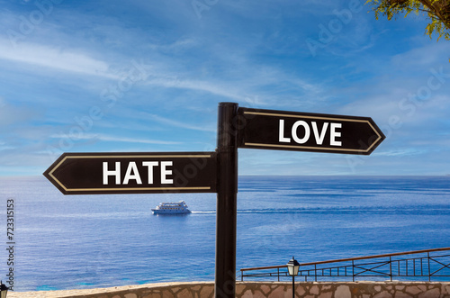 Love or hate symbol. Concept word Love or Hate on beautiful signpost with two arrows. Beautiful blue sea sky with clouds background. Business and love or hate concept. Copy space.