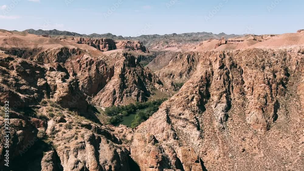 Charyn Canyon in Kazakhstan.View of the amazing canyon in Central Asia. Mountain ranges in a fabulous canyon. Shots of the landscape above the rocky Charyn Canyon on the Charyn River trail in sunlight