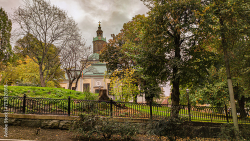 Photography Beautiful shot of a church surrounded by lush foliage in Stockholm