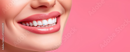 Woman's White Smile with Rhinestone Tooth Decoration. Close-up of a smiling woman's mouth with a sparkling rhinestone on her tooth, banner template, copy space.  photo