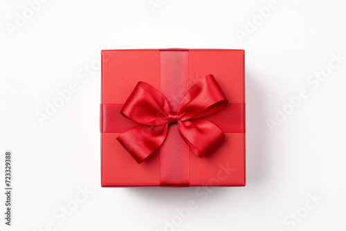 Top view of red Christmas or Valentine gift box with ribbon on white background