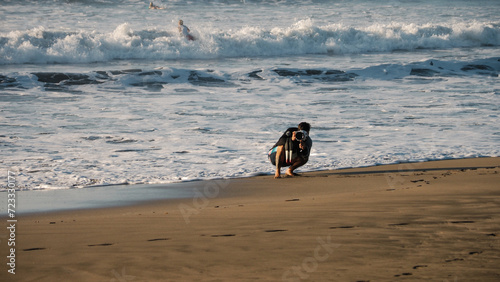 photographer coming out of the water