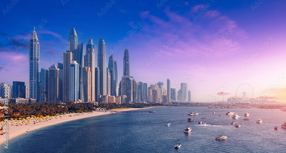 Naklejka premium Downtown of UAE with modern futuristic skyscraper. Aerial top view Dubai, panoramic of Marina and JBR sand beaches, sunset time