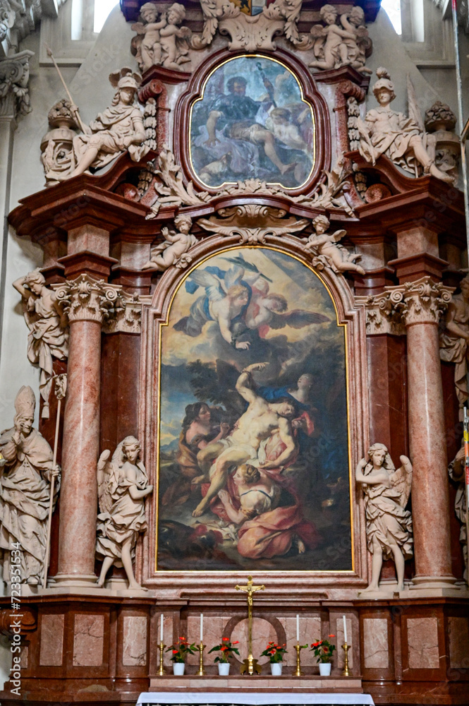 St. Stephen's Cathedral in Passau, painting behind an altar, famous baroque bishop's church in summer with a blue sky, Passau, Lower Bavaria, Germany