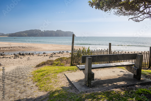 wooden bench at hot water beach in new zealand