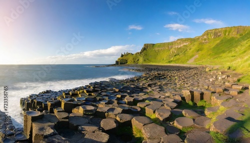 the giant s causeway at dawn on a sunny day with the famous basalt columns the result of an ancient volcanic eruption county antrim on the north coast of northern ireland uk photo