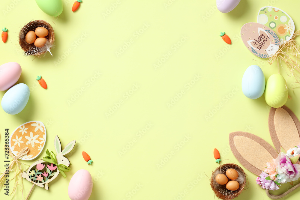 Happy Easter card. Flat lay composition with bunny ears decorated flowers, nests of eggs, wooden decorations, colorful Easter eggs on light green background