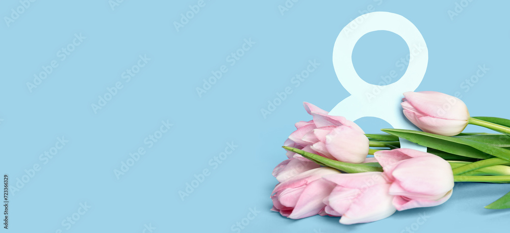 Beautiful bouquet of tulips and figure 8 on light blue background with space for text. International Women's Day celebration Beautiful bouquet of tulips and figure 8 on light blue background with space for text. International Women's Day celebration