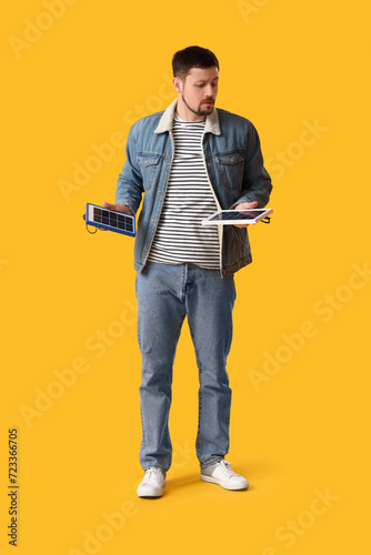 Handsome man with portable ...