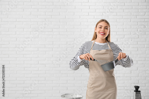 Pretty young woman in apron...