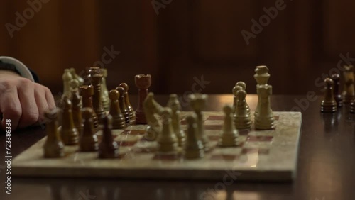 Knight's move on the chessboard in the background light