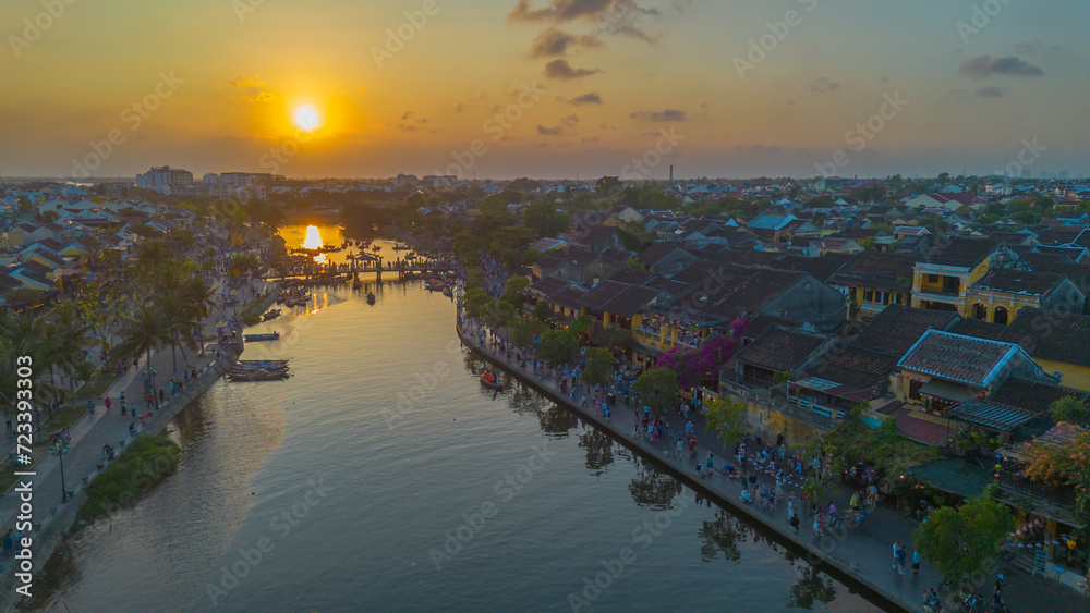 Aerial drone view of Hoi An city during a sunset in Vietnam. Ancient town, UNESCO world heritage, at Quang Nam province. 