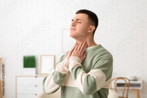 Young man with thyroid glan...