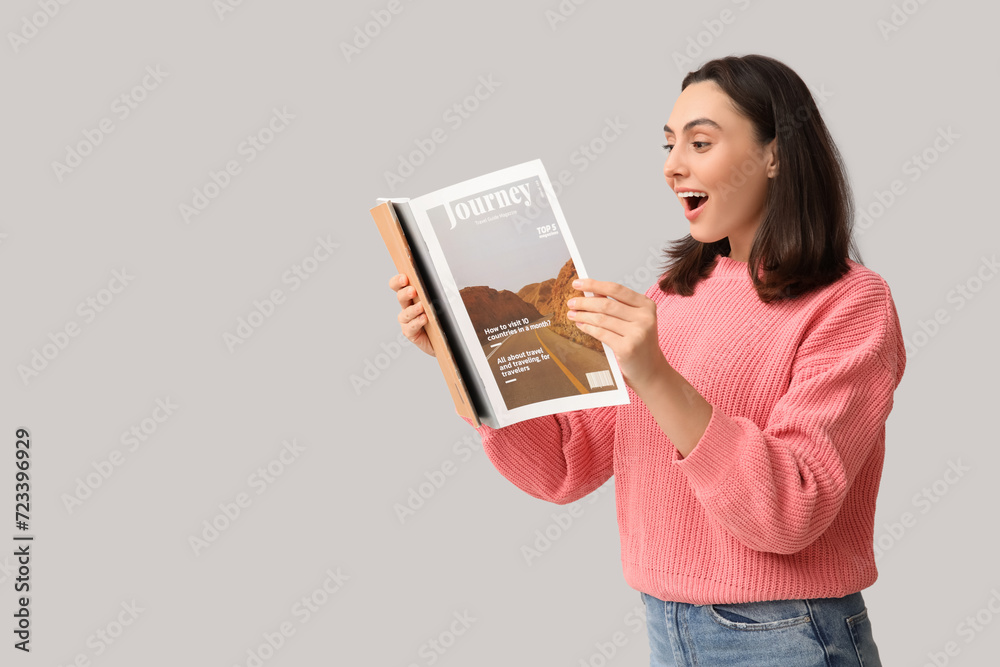 Beautiful woman with magazines on light background Beautiful woman with magazines on light background