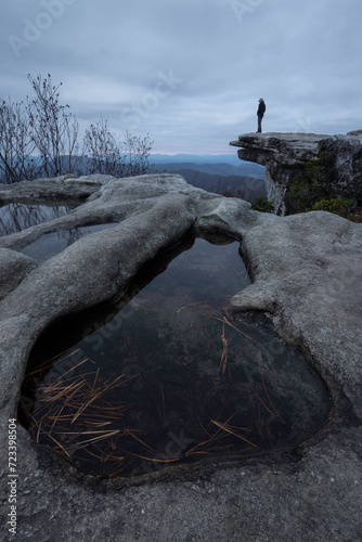 A man poses at the edge of the famous McAfee Knob overlook, one of the most photographed spots along the Appalachian Trail. photo