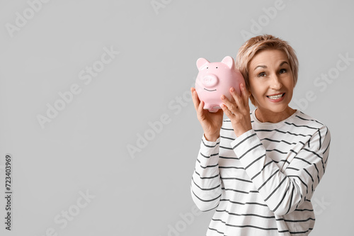 Happy mature woman with pig...