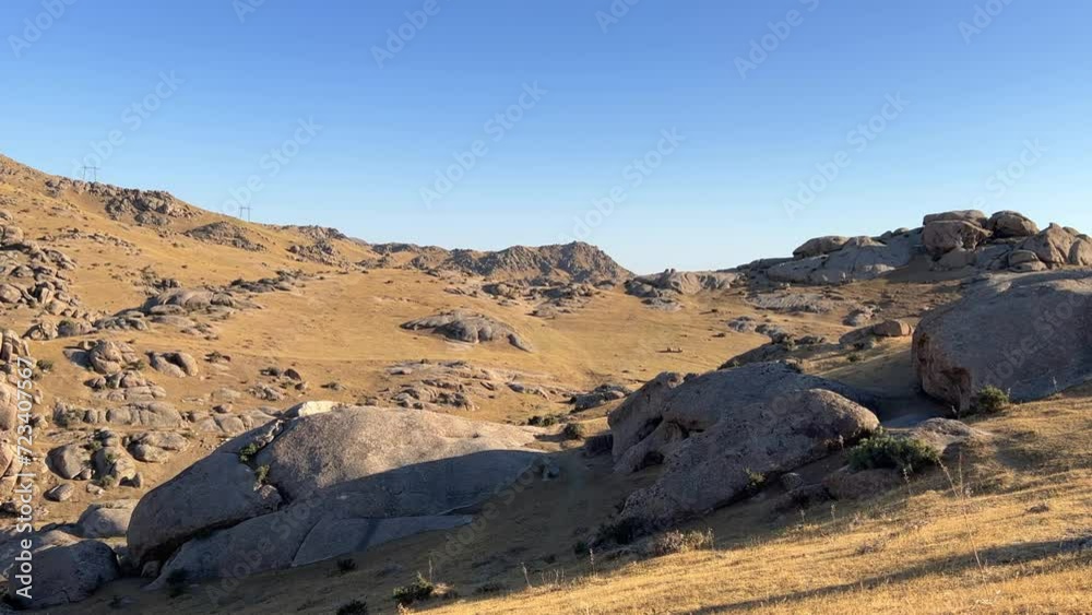 The Valley of Demons in Uzbekistan in the Samarkand region. Boulders, granite sculptures, huge boulders of bizarre shapes in the spurs of the Zaravshansky ridge. 4K Video The Valley of Demons in Uzbekistan in the Samarkand region. Boulders, granite sculptures, huge boulders of bizarre shapes in the spurs of the Zaravshansky ridge. 4K Video