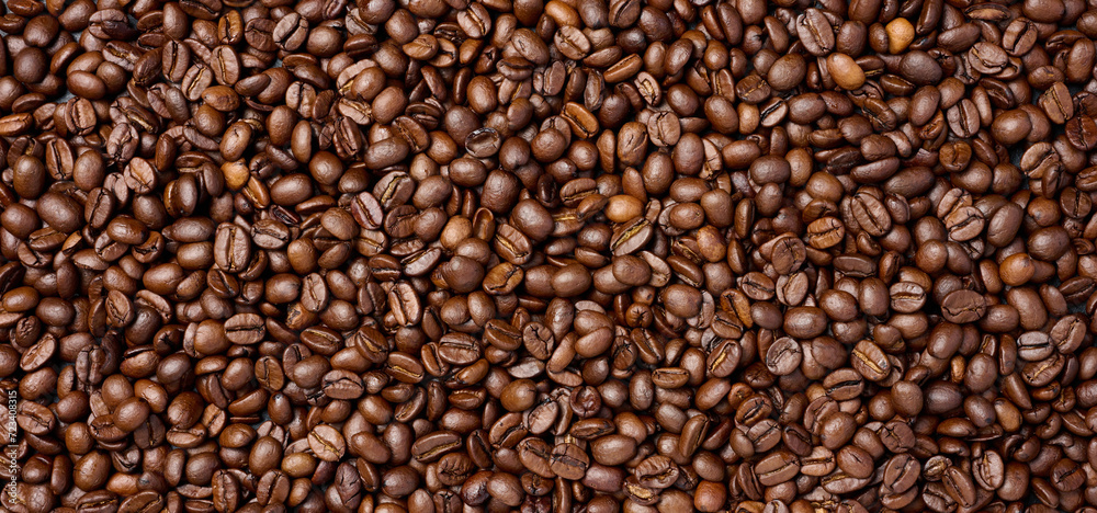 Scattered roasted coffee beans, full frame Scattered roasted coffee beans, full frame