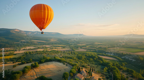 A couple enjoying a scenic hot air balloon ride over the picturesque landscapes of Provence, creating a dreamy and romantic scene, with copy space for whimsical text © Лариса Лазебная