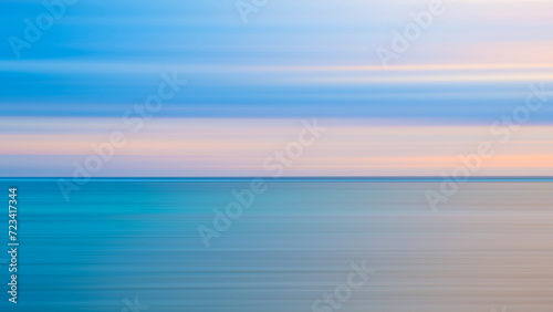 Fototapeta Naklejka Na Ścianę i Meble -  Abstract background of blue sea wave Motion blur sea water and beautiful sunset with clouds