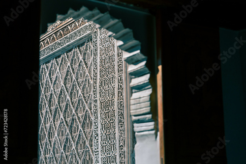 Decorative Calligraphy in Ben Youssef Madrasa, Marrakech, Morocco - Play of Light and Shadow photo
