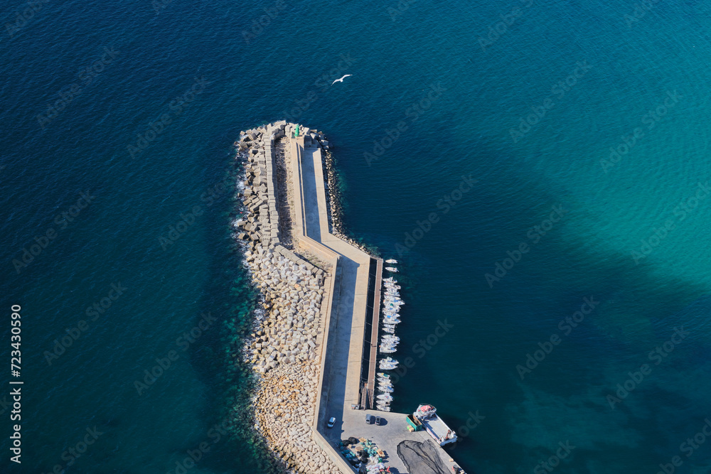 Aerial view of port in Calpe town. Port full of yachts and a view of the pier.
Calp, Alicante, Spain Aerial view of port in Calpe town. Port full of yachts and a view of the pier.
Calp, Alicante, Spain