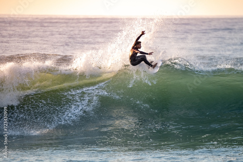 Photos Young surfer enjoying waves