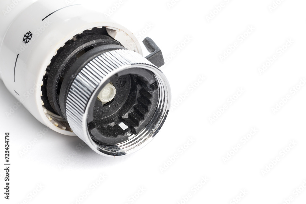 White head for a thermostatic valve isolated on a white background, close -up. (selective focus) White head for a thermostatic valve isolated on a white background, close -up. (selective focus)