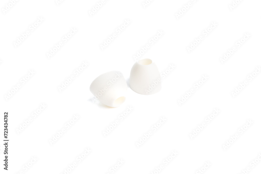 White rubber overlays for in -ear headphones isolated on a white background, close -up. (selective focus)
