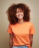 Smiling woman with curly hair wearing an orange t - shirt. Generative AI.