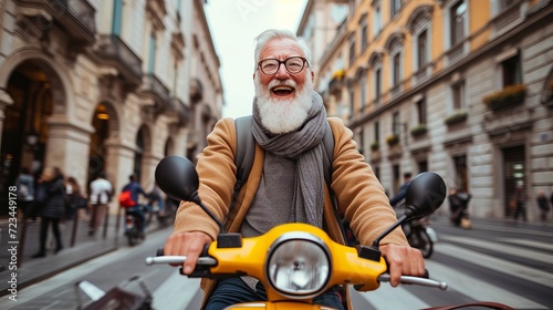 Happy senior man riding yellow scooter in italy, enjoying summer vacation on trendy road trip