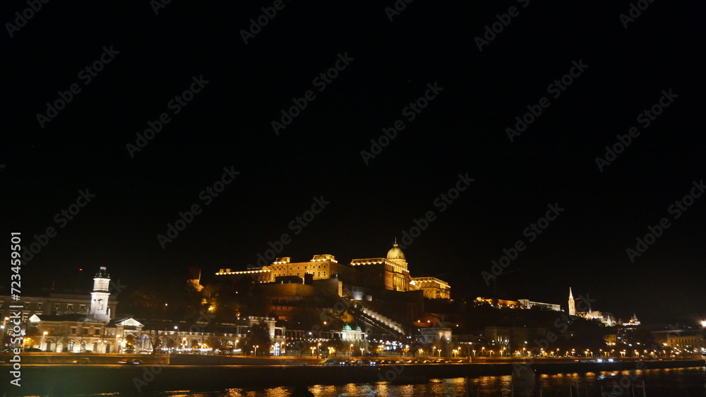 Hungary Budapest night sailing and view of Buildings infrastructures bridges landmarks in the city along Rhine river and Danube river
