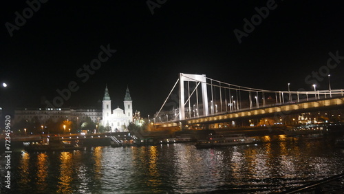 Hungary Budapest night sailing and view of Buildings infrastructures bridges landmarks in the city along Rhine river and Danube river  © NKM