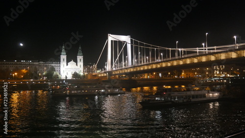 Hungary Budapest night sailing and view of Buildings infrastructures bridges landmarks in the city along Rhine river and Danube river 