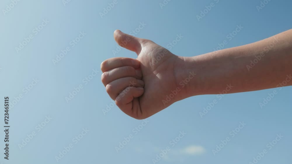 Hand for taxi close up on road, Young woman calling a taxi raising her arm in the street. Transport concept Hand for taxi close up on road, Young woman calling a taxi raising her arm in the street. Transport concept