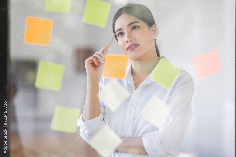 Business Asian woman meeting at office and use post it notes in glass wall to share idea. Brainstorming business office concept. Sticky note on glass wall.
Business Asian woman meeting at office and use post it notes in glass wall to share idea. Brainstorming business office concept. Sticky note on glass wall.