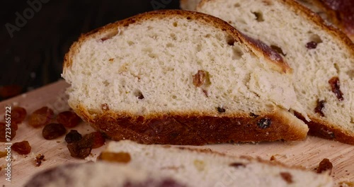 Wallpaper Mural fresh bun with golden raisins on a board, fresh and sweet wheat bun with raisins Torontodigital.ca