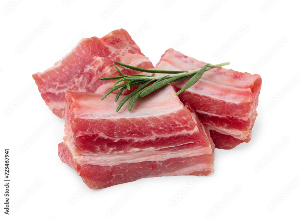 Cut raw pork ribs with rosemary isolated on white Cut raw pork ribs with rosemary isolated on white