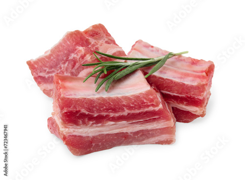 Cut raw pork ribs with rosemary isolated on white