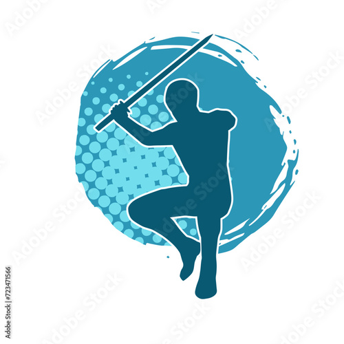 Silhouette of a male warrior in action pose with sword weapon. Silhouette of a man fighter carrying sword weapon.